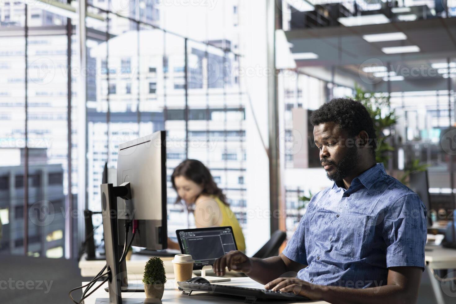 System administrator conducting detailed code review to fix bugs, identifying potential performance and technical issues with company software. African american man debugging and optimizing code photo