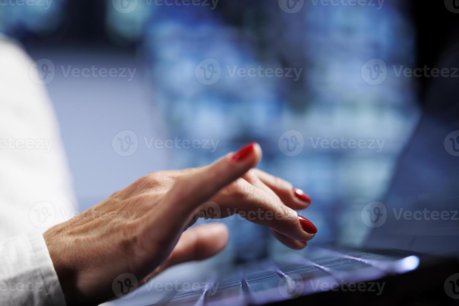 Senescent worker using laptop, setting up high bandwidth dedicated multiplayer gaming servers in high tech workspace to accommodate more traffic from worldwide locations and avoid low ping, close up photo