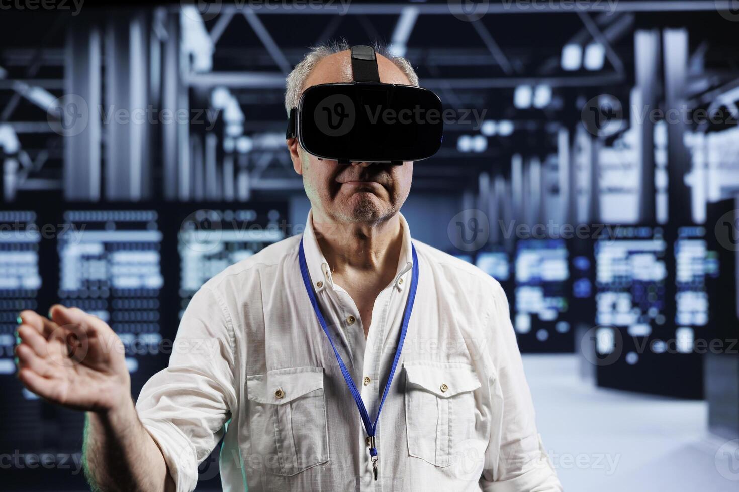 Old developer immersed in virtual reality at data center, doing hardware maintenance. Professional using VR headset to optimize server rows system performance, harnessing cutting edge technology photo