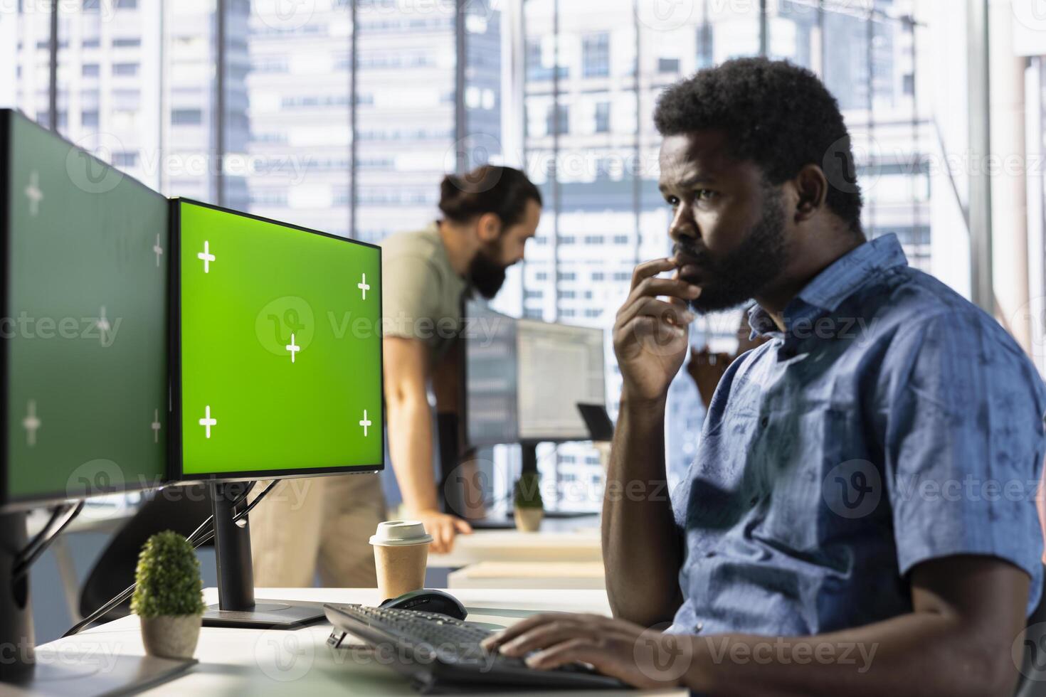 Man checking paperwork details on chroma key PC screen, solving tasks. Worker in office making sure documents are compliant with quality assurance standards using isolated screen computer photo