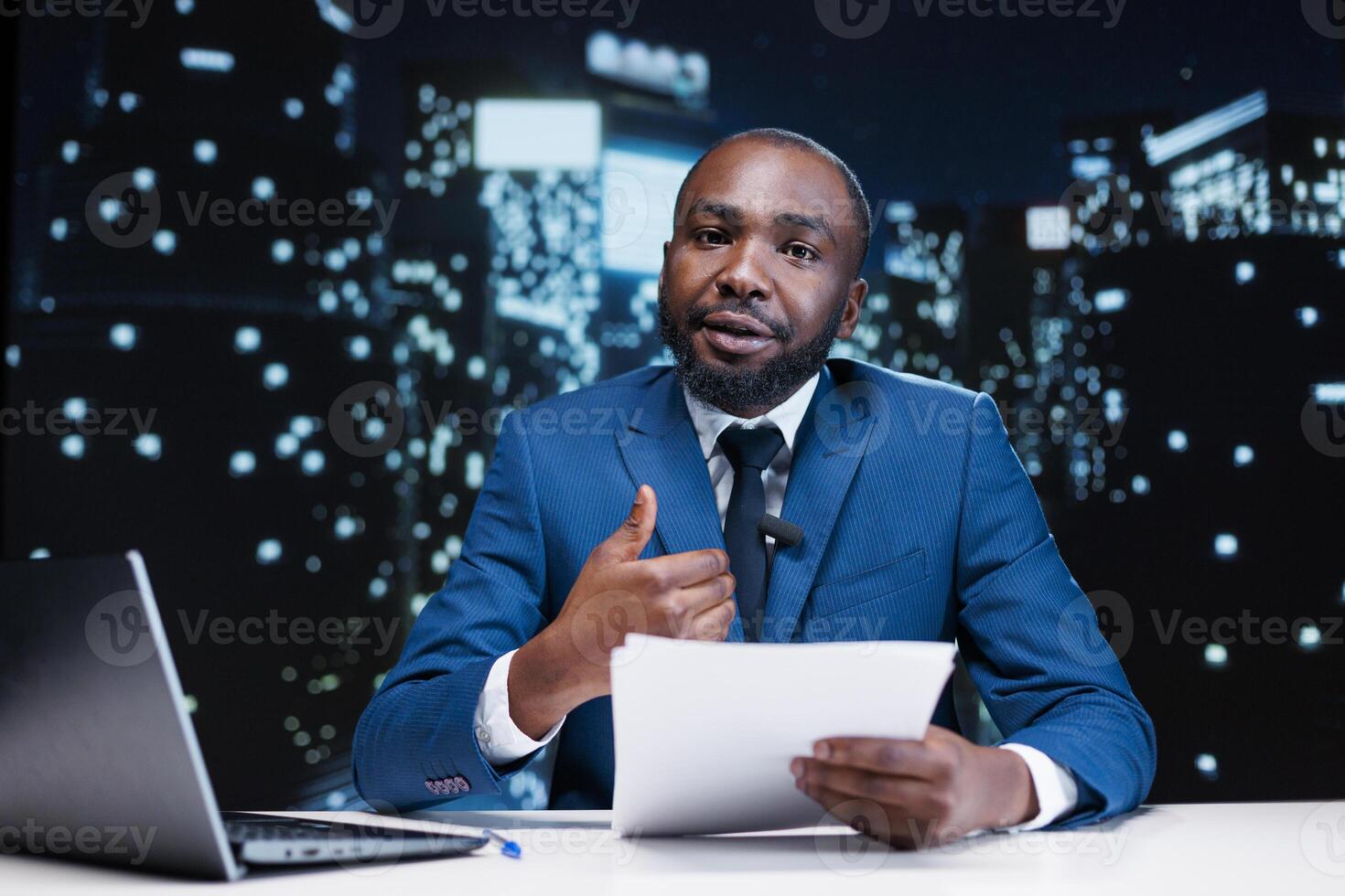 Man reporter reading daily headlines in newsroom, presenting important information regarding public interest during night show segment. Media journalist collecting details to debate on tv channel. photo