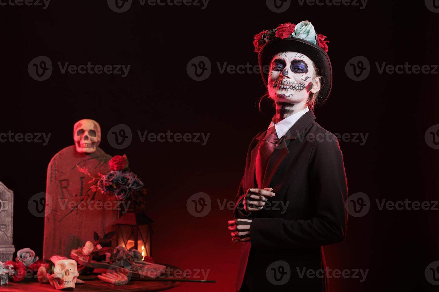 Portrait of smiling lady with hat at religious processions during Dia de los Muertos november holiday. Joyous woman wearing formal suit and skeleton makeup symbolizing reverence for deceased photo