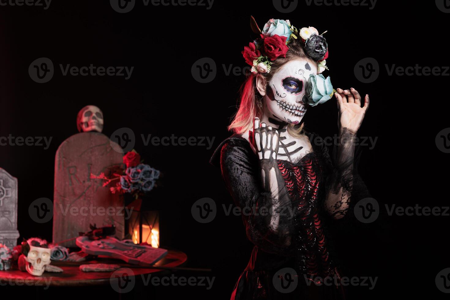 Mysterious woman covering eye with rose during Day of the Dead Halloween event honoring dead loved ones. Eerie lady being enigmatic during ancient Aztec custom of celebrating ancestors photo