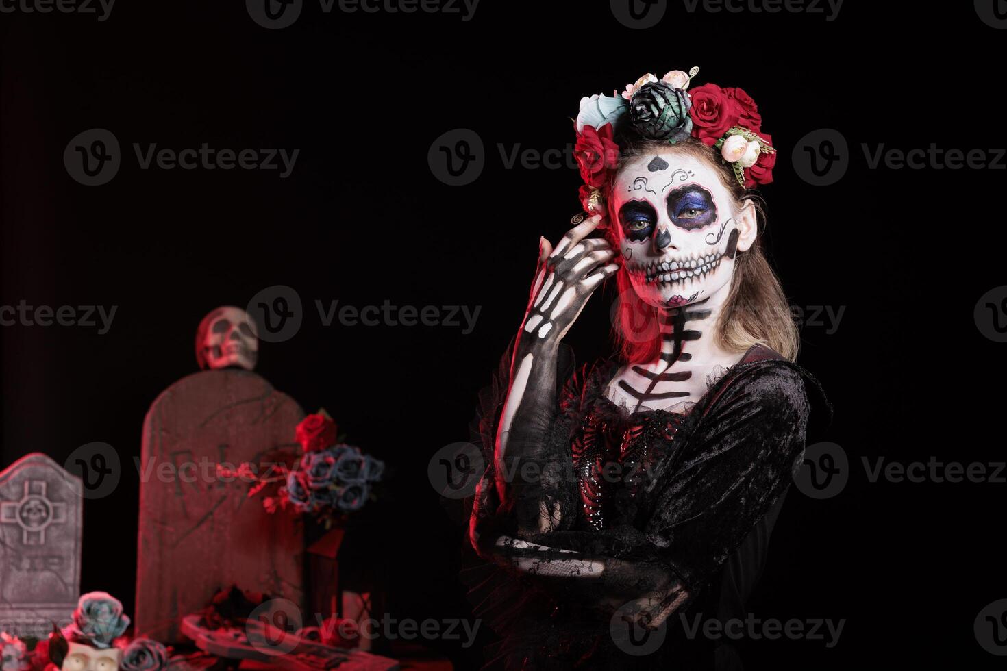 Portrait of woman participating in Day of the Dead Mexican event honoring dead loved ones, building ofrendas for them. Person doing ancient Aztec custom of celebrating ancestors, wearing flower wreath photo