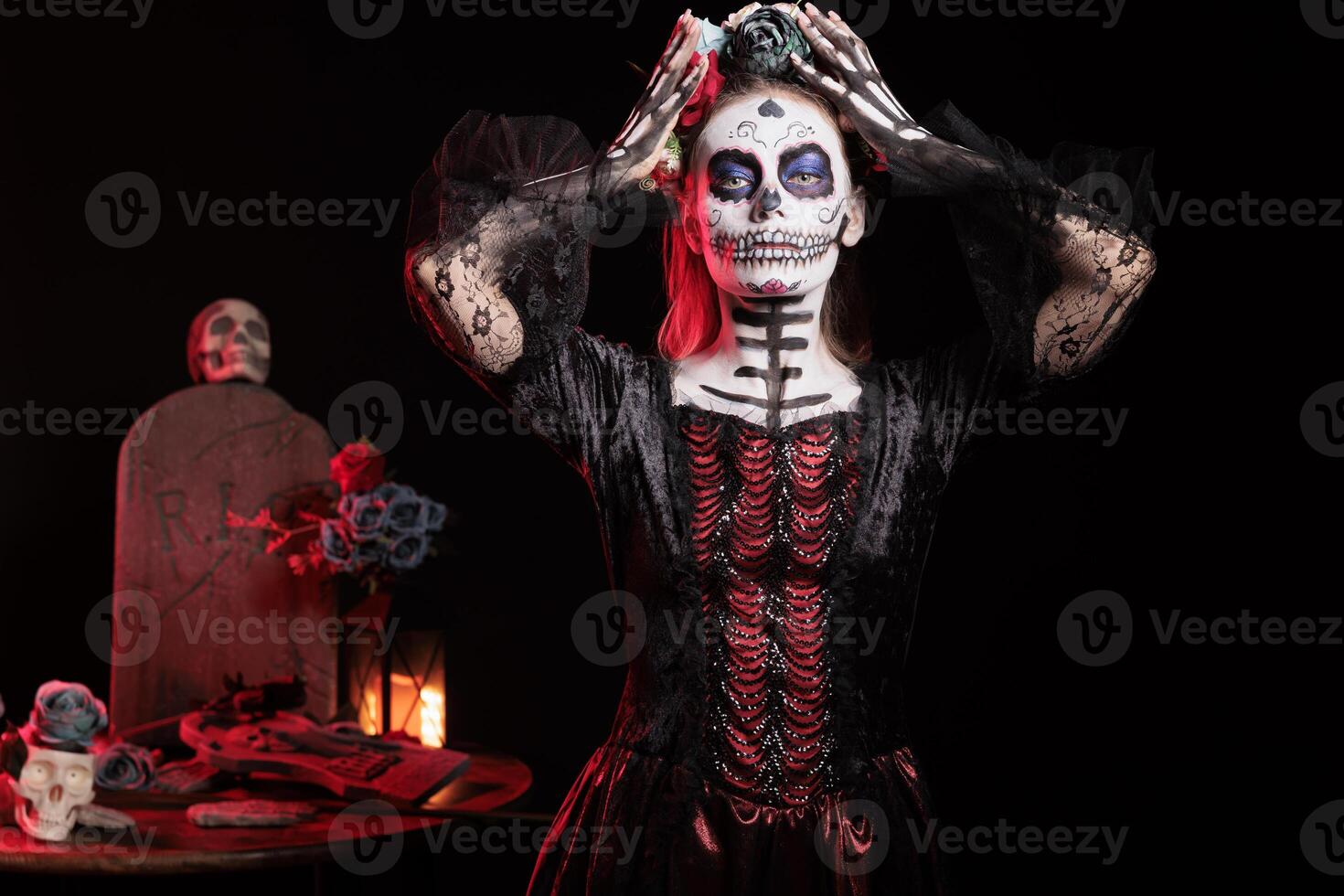 Portrait of person at religious processions during Dia de los Muertos. Woman wearing skull makeup and floral crown symbolizing reverence for the deceased, dark studio background photo