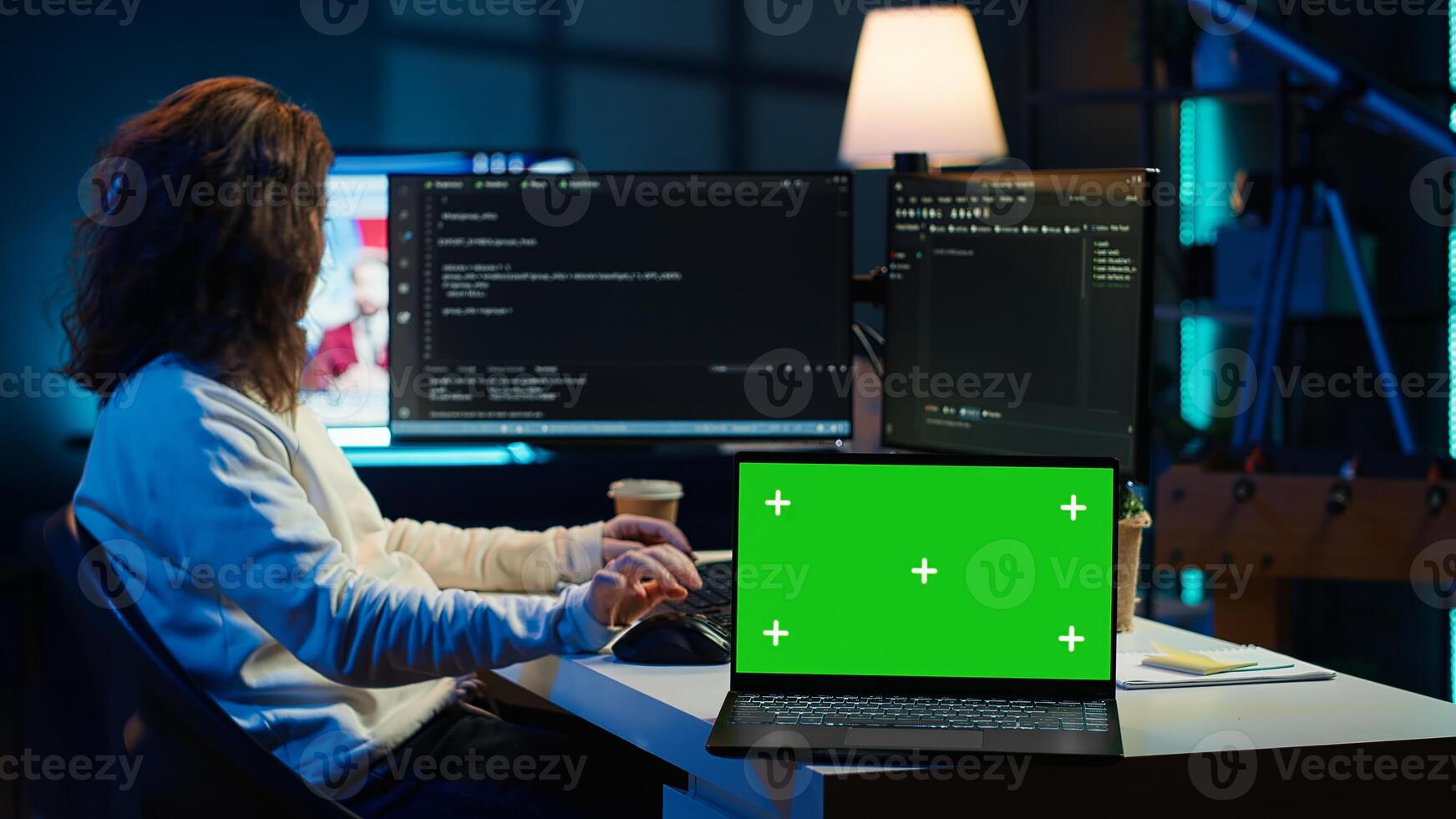 Admin using green screen laptop to implement security measures, protecting company systems and data. IT worker testing and debugging code for software applications on chroma key notebook, camera A photo