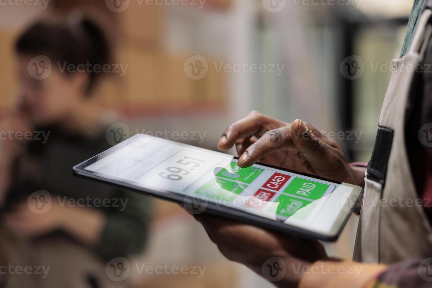 Small business manager supervising goods inventory using software application on tablet computer in storage room. Storehouse supervisor managing parcels transportation. Close up concept photo