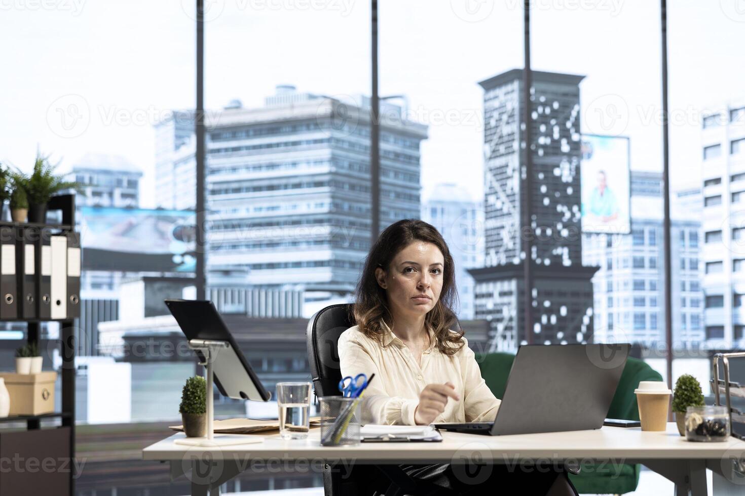 Powerful female entrepreneur focuses on strategic planning, setting a clear vision and goals for the corporation and aligning resources to achieve sustainable growth. Ambition and determination. photo