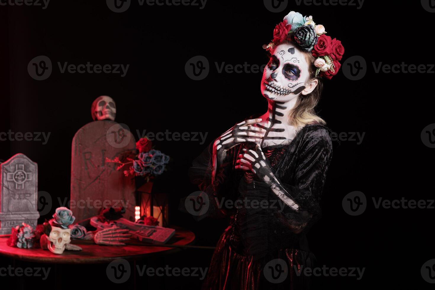 Woman wearing elegant silk dress during Day of the Dead Mexican event honoring dead loved ones. Person with skeleton body paint during ancient Aztec custom of celebrating ancestors photo