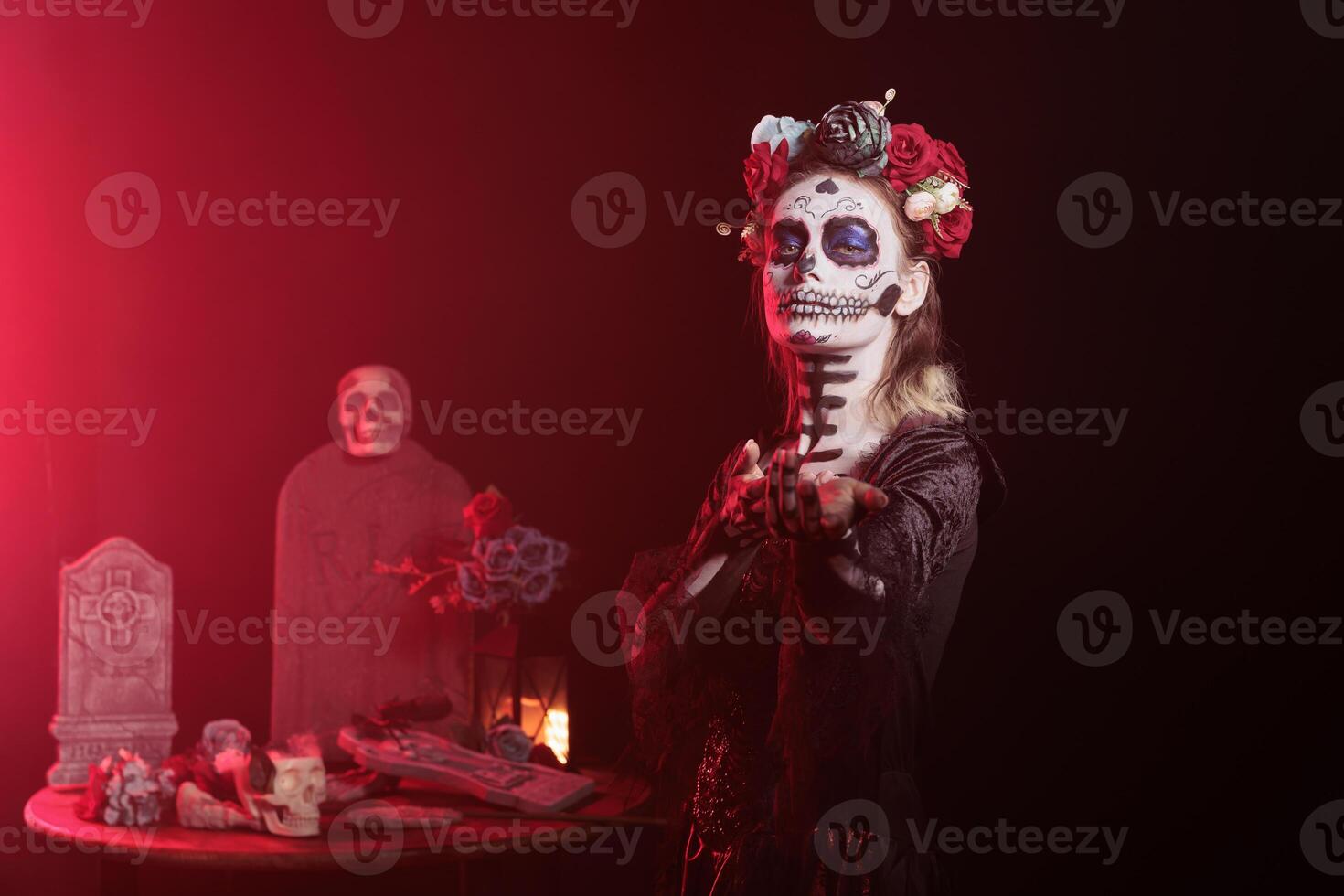 Portrait of woman doing enticing invitation hand gesture for Day of the Dead Mexican celebration. Lady doing seducing wooing gesturing during ancient Aztec custom of celebrating ancestors photo