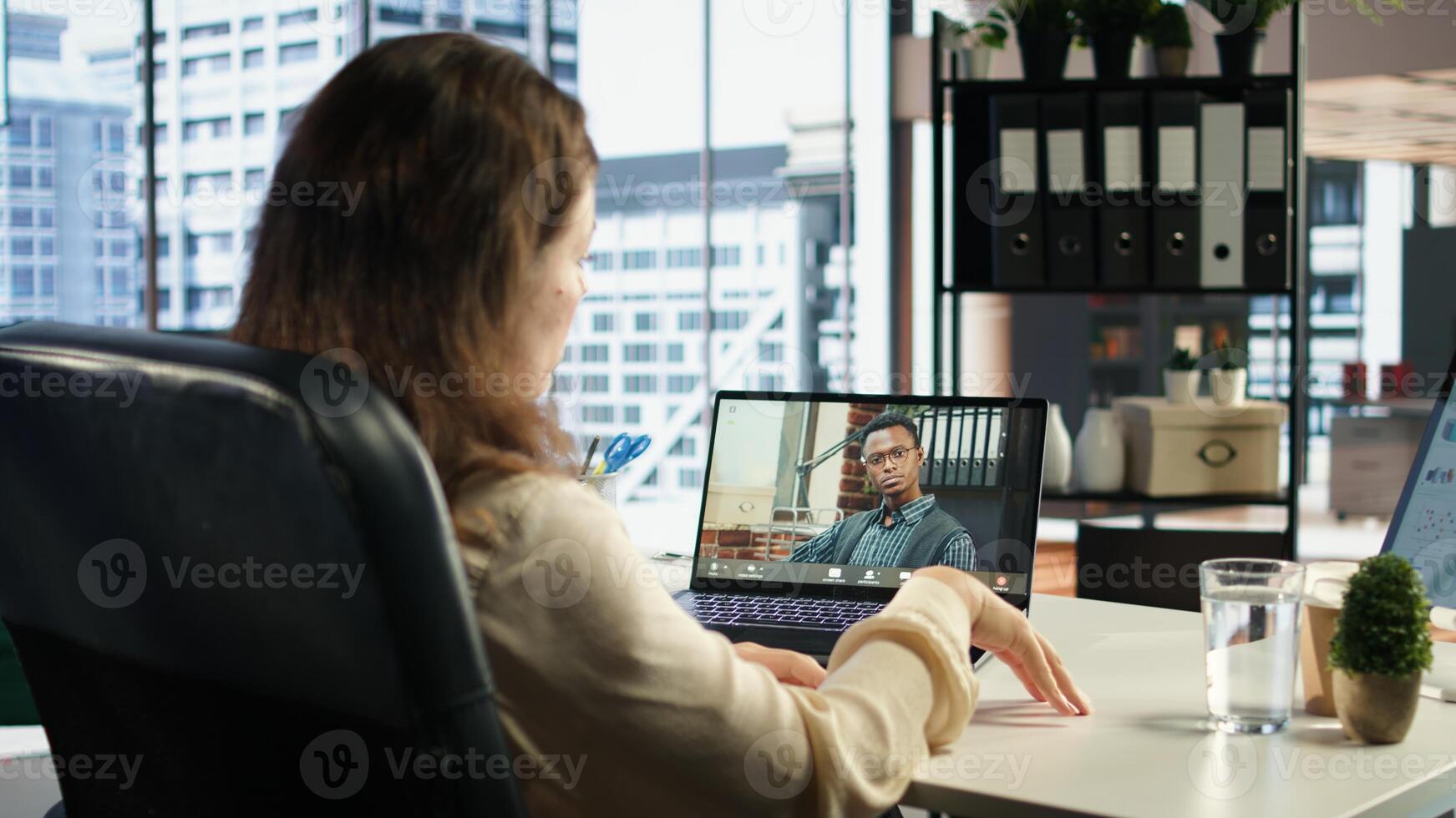 Female director discusses corporate social responsibility on videocall, emphasizing the importance of ethical practices and sustainability for business success. Advisory board meeting. Camera A. photo