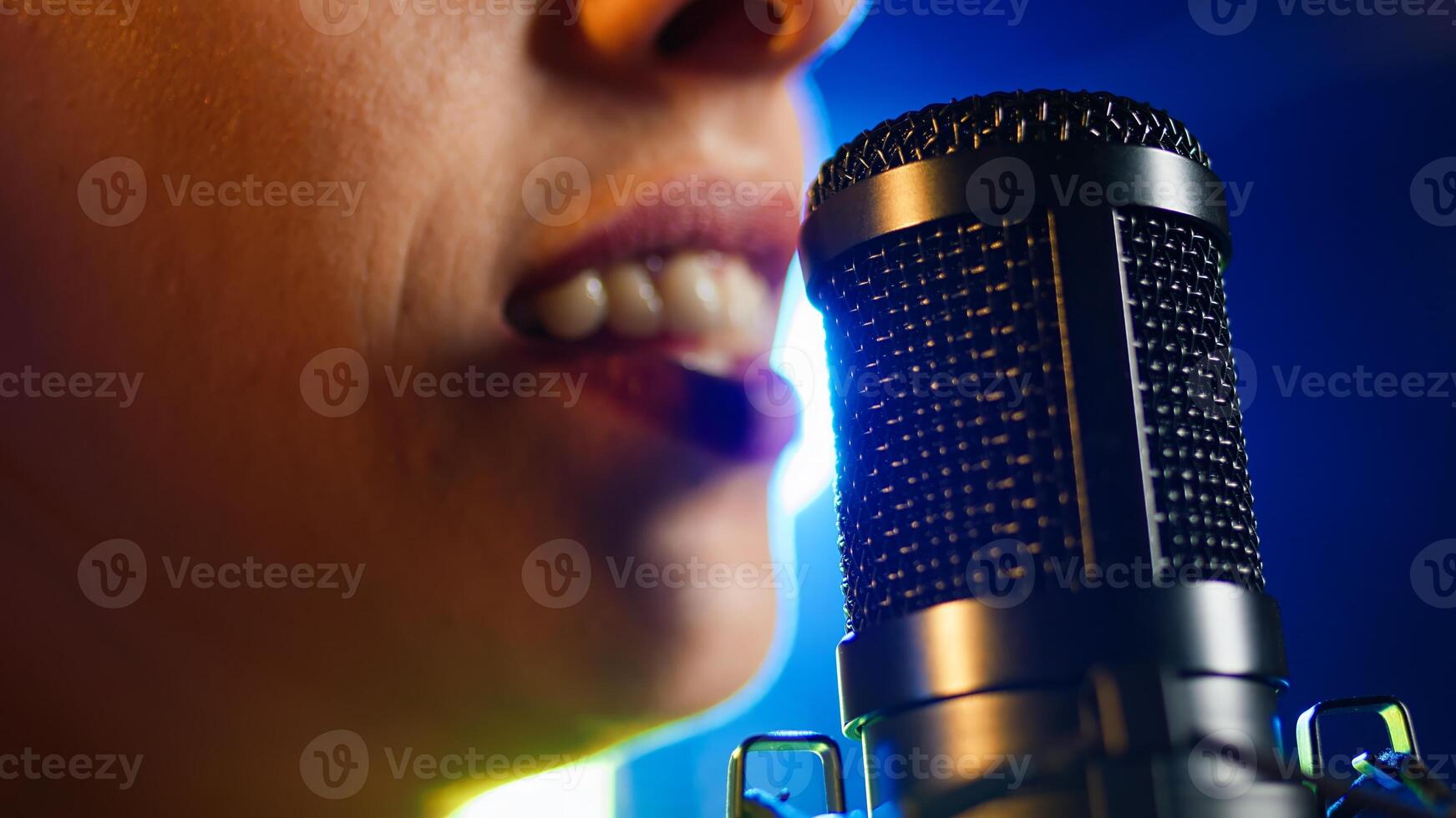 Confident female singer performing live in a rock nightclub, showing off her bold melodic voice. Edgy independent woman singing under the spotlights, rebellious energy. Close up. Camera A. photo