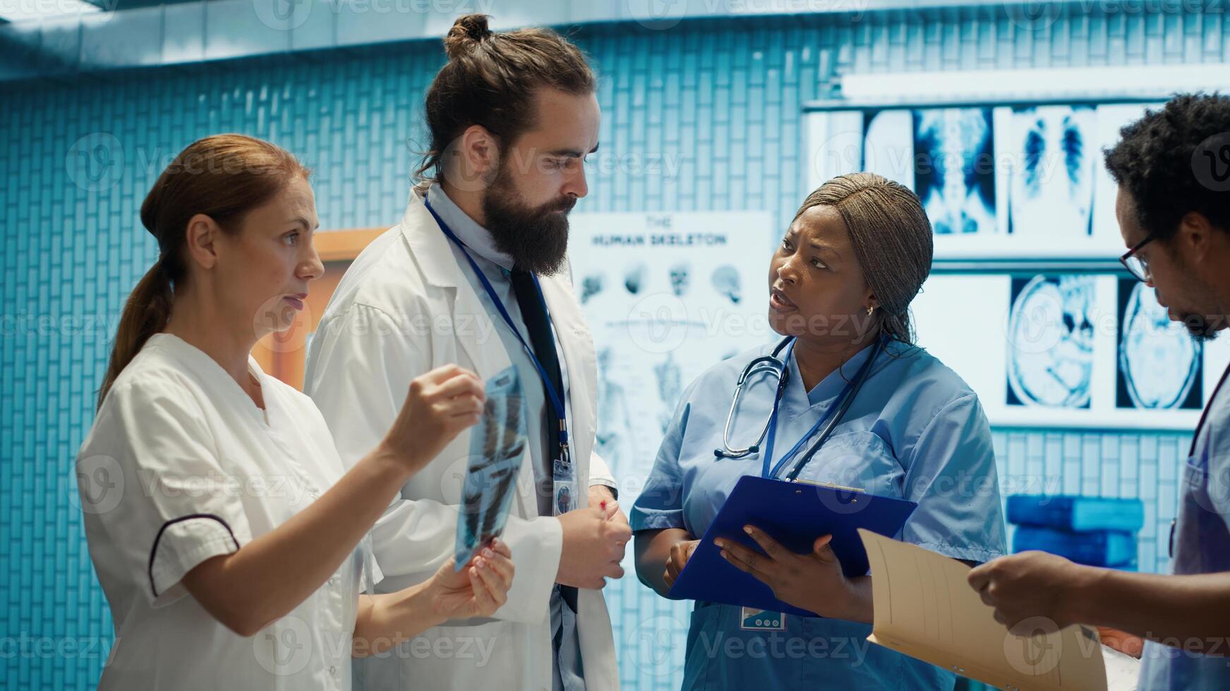 Doctors and radiologists review human anatomy scans to develop treatment service. Doing teamwork and expertise in radiology and diagnostics for correct healthcare solutions. Camera A. photo
