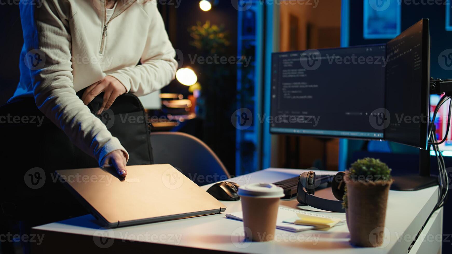 Teleworking programmer arriving in home office, ready to secure company servers from virus attacks by coding. IT employee starting job shift, building firewalls protecting data from threats, camera B photo