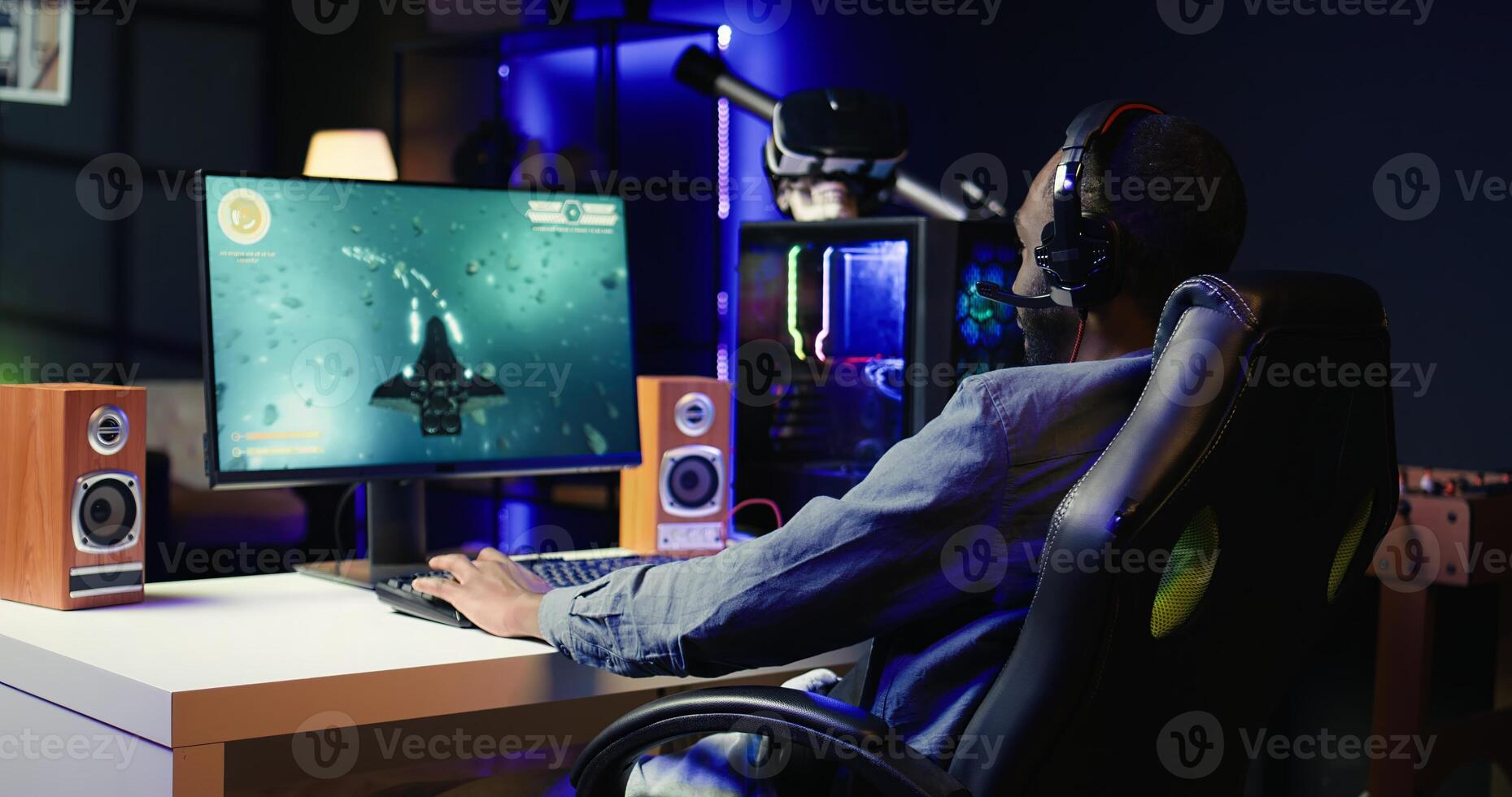 Man feeling happy while playing science fiction videogames on computer desktop, celebrating victory. Cheerful gamer overjoyed after winning game on gaming PC, close up, camera B photo