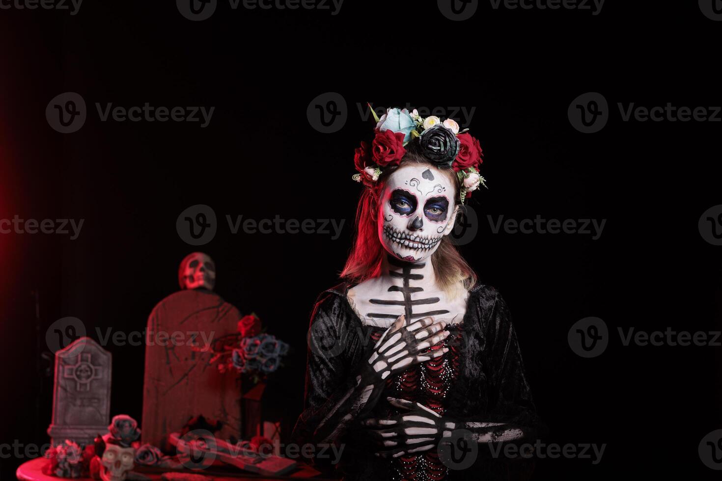 Portrait of mysterious witch at religious processions during Dia de los Muertos november holiday. Woman dressed as La Catrina wearing skeleton makeup symbolizing reverence for deceased photo