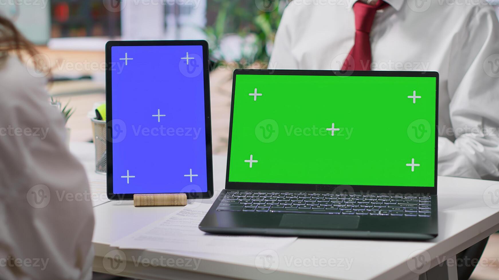 Team of recruiters interviewing job applicant with a green screen on desk, discussing about potential career development plans and his aspirations. Women attend an interview with candidate. Camera A. photo