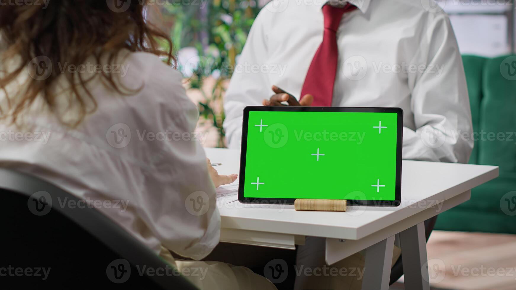 Recruiters and job applicant attending an interview with isolated copy space device, HR staff asking candidate about career achievements and goals. Reading qualifications on the resume. Camera A. photo