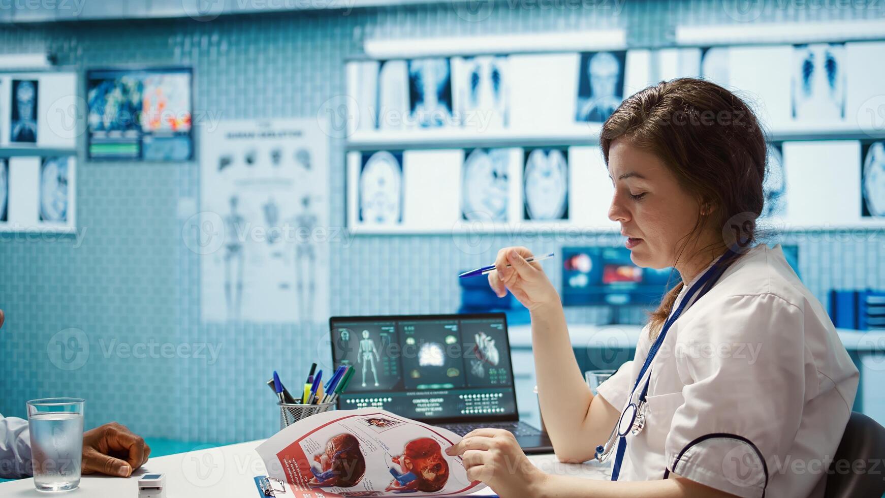 Female doctor and patient engage in a medical consultation for a scan interpretation of x ray results. Physician specialist emphasizing modern healthcare practices and medical research. Camera B. photo