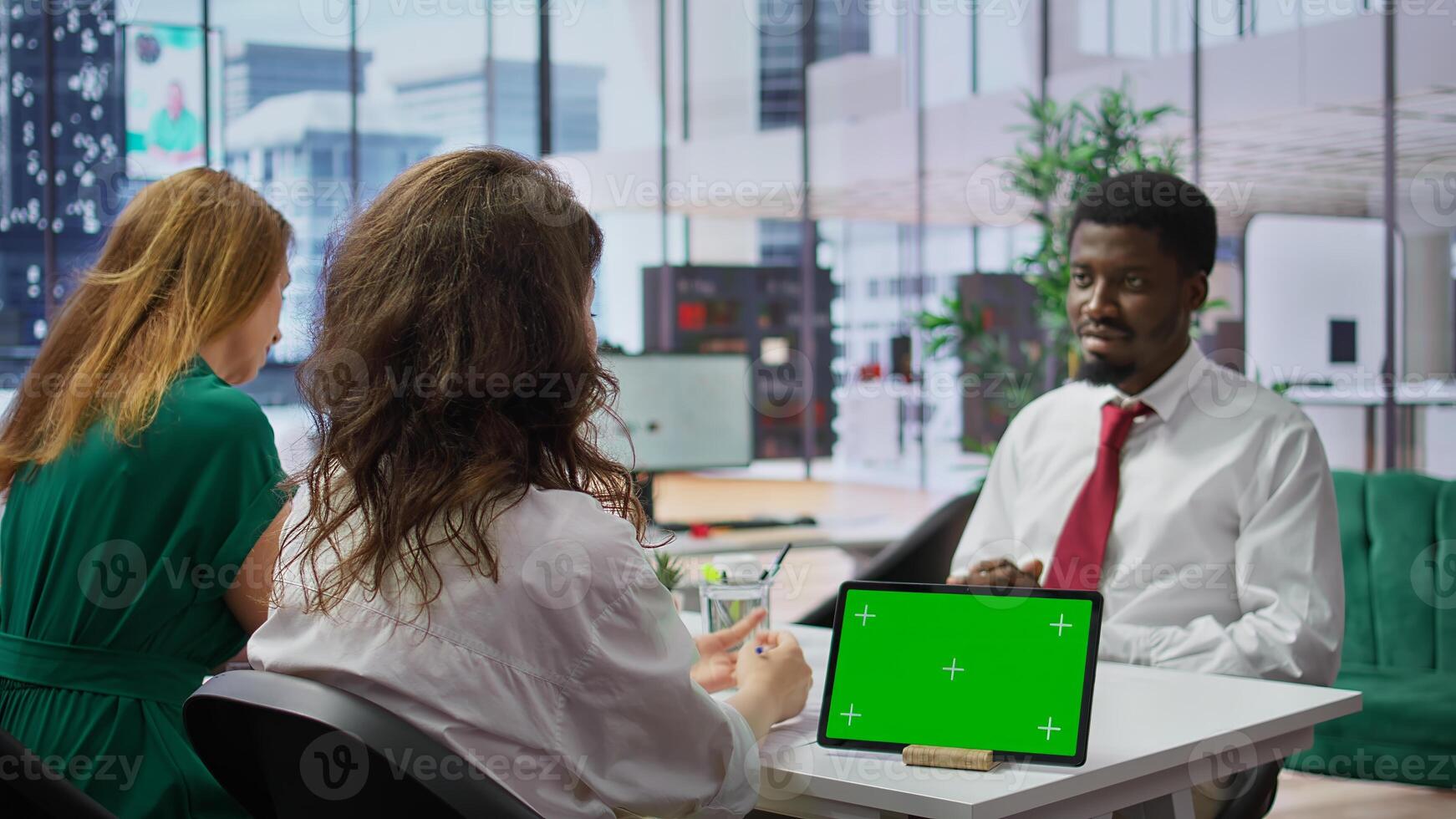 Recruiters and job applicant attending an interview with isolated copy space device, HR staff asking candidate about career achievements and goals. Reading qualifications on the resume. Camera B. photo