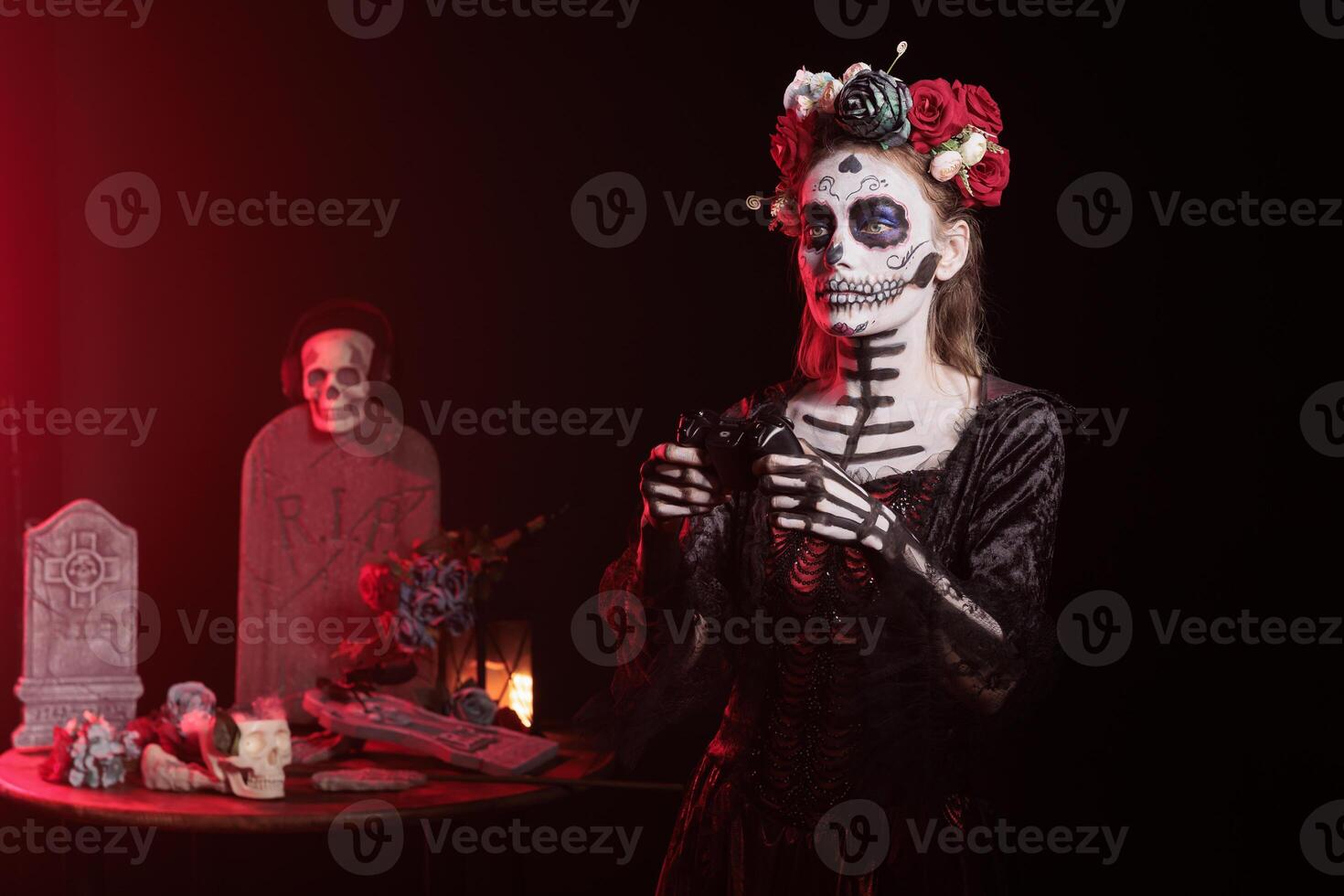 Woman playing videogames with controller at Day of the Dead event to remember the deceased. Lady enjoying games with gamepad during Mexican holiday of remembrance for those who have passed photo