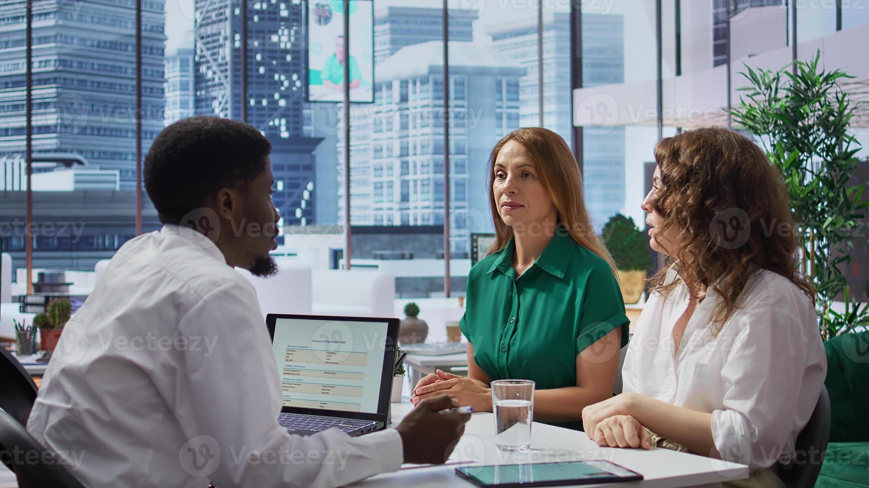 HR manager discussing with the last two remaining job candidates, having to make a choice and hire the most suitable person for the job opening. Recruiter works on selection process. Camera B. photo
