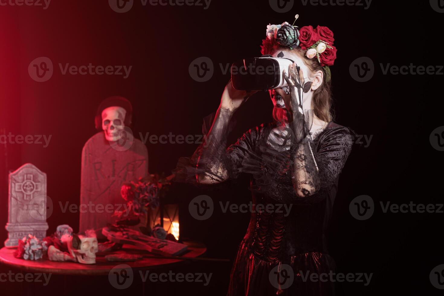 Woman using virtual reality technology at Day of the Dead event to remember the deceased. Lady using VR headset during Mexican holiday of remembrance for those who have passed photo