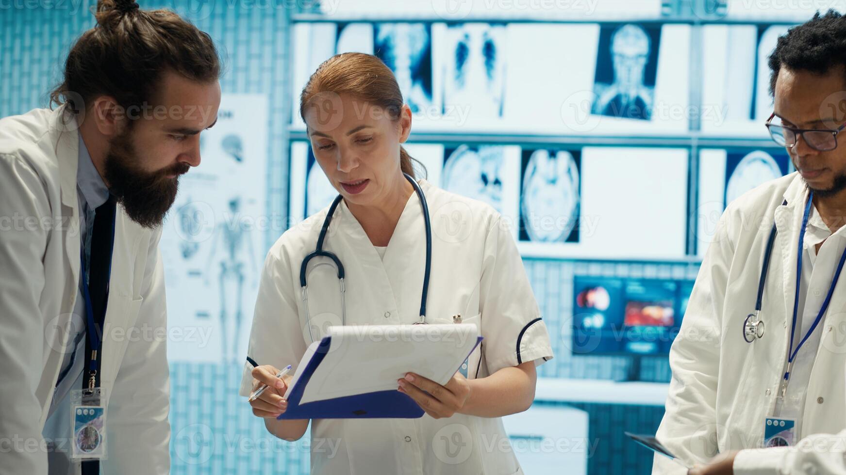 Expert physicians comparing test results and healthcare records in cabinet, consulting colleagues for disease prevention. Diverse medics sharing their professional expertise in a meeting. Camera A. photo