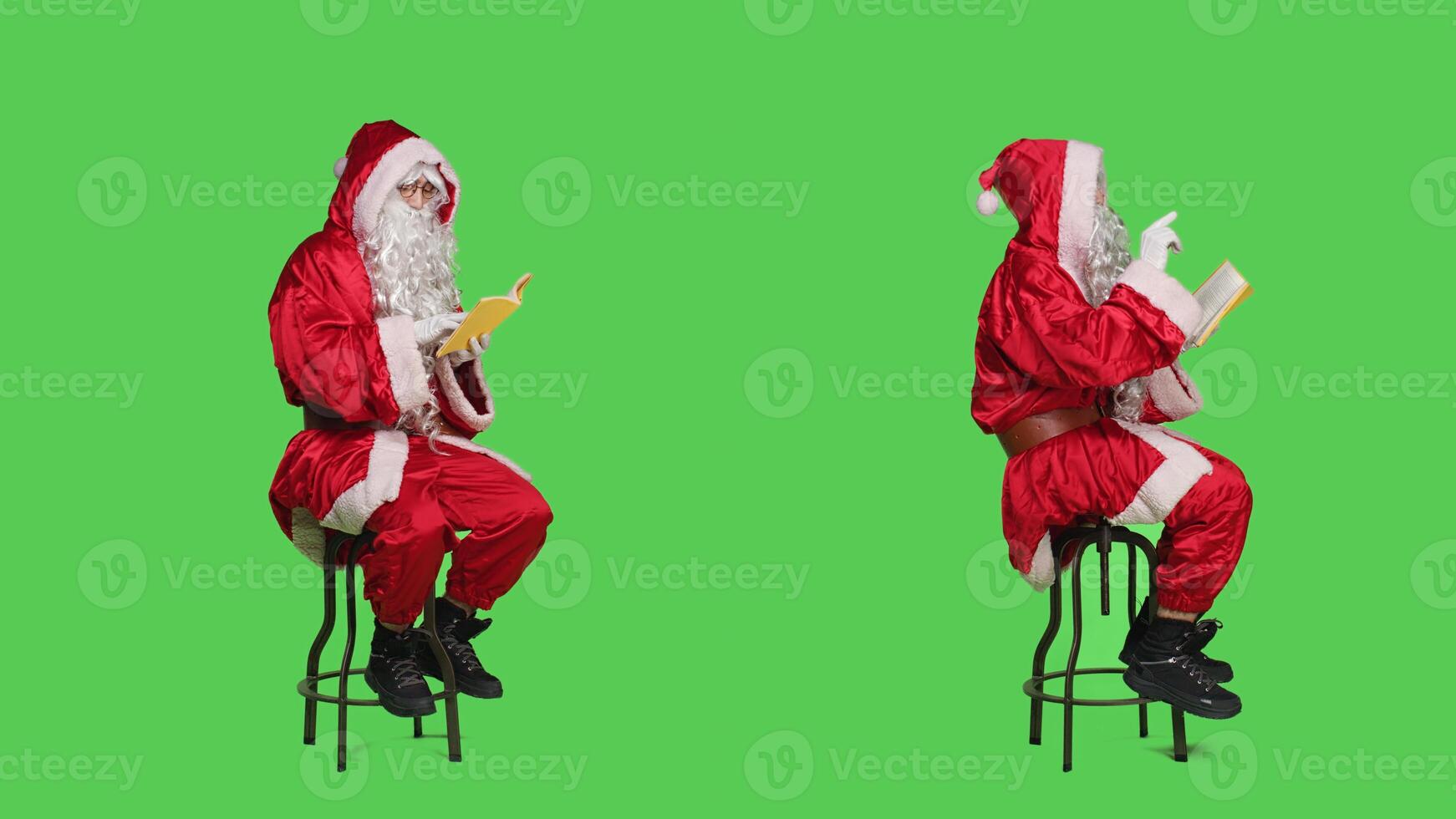 Father christmas reading literature in studio with full body greenscreen, enjoying hobby with fiction or poetry book. Wise cultured saint nick reads novel story for lecture, having fun. photo