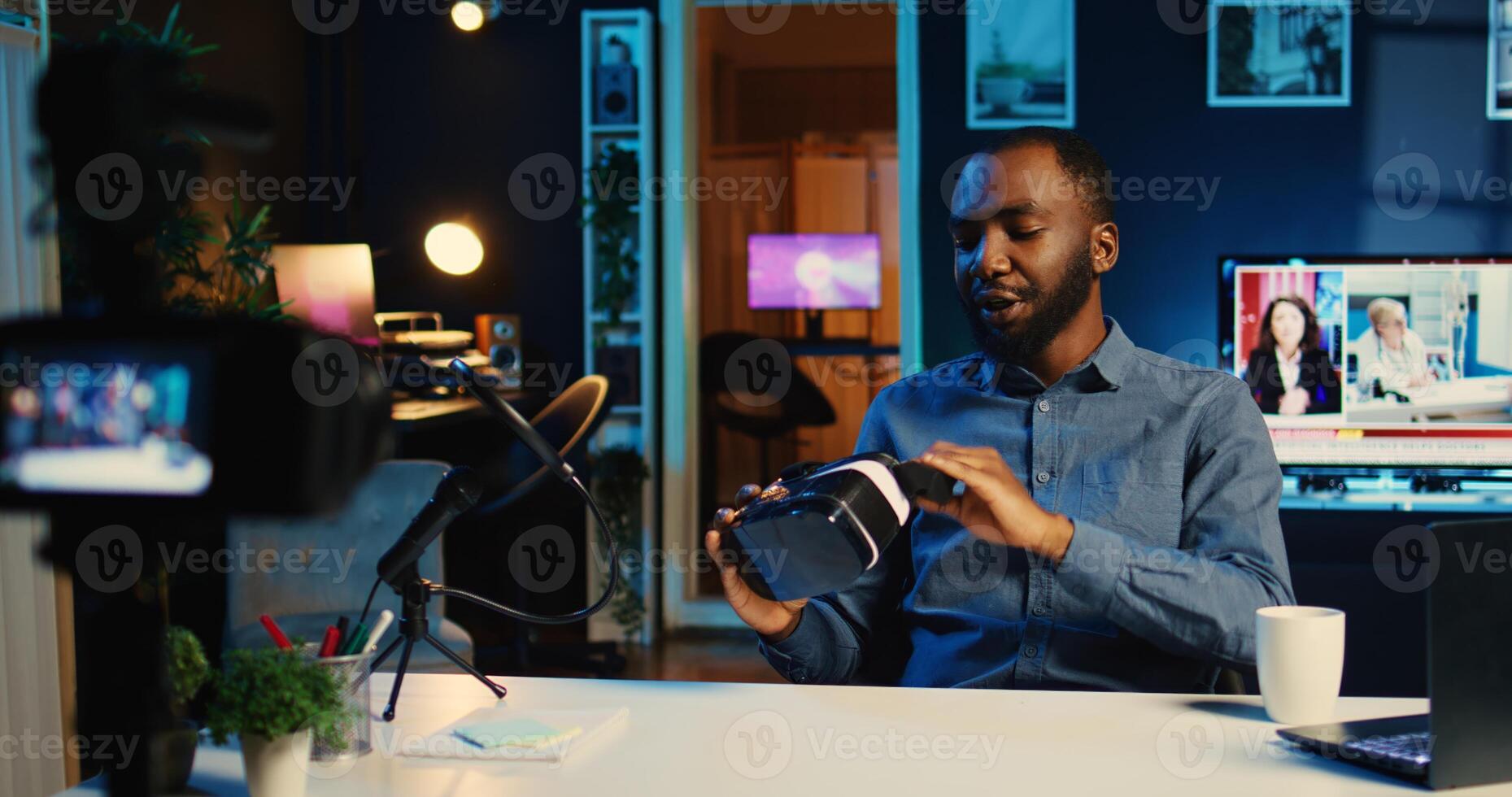 Tech content creator filming sponsored unboxing of newly released gaming VR glasses product. Viral internet star offers virtual reality headset recommendation to subscribers on online platforms photo