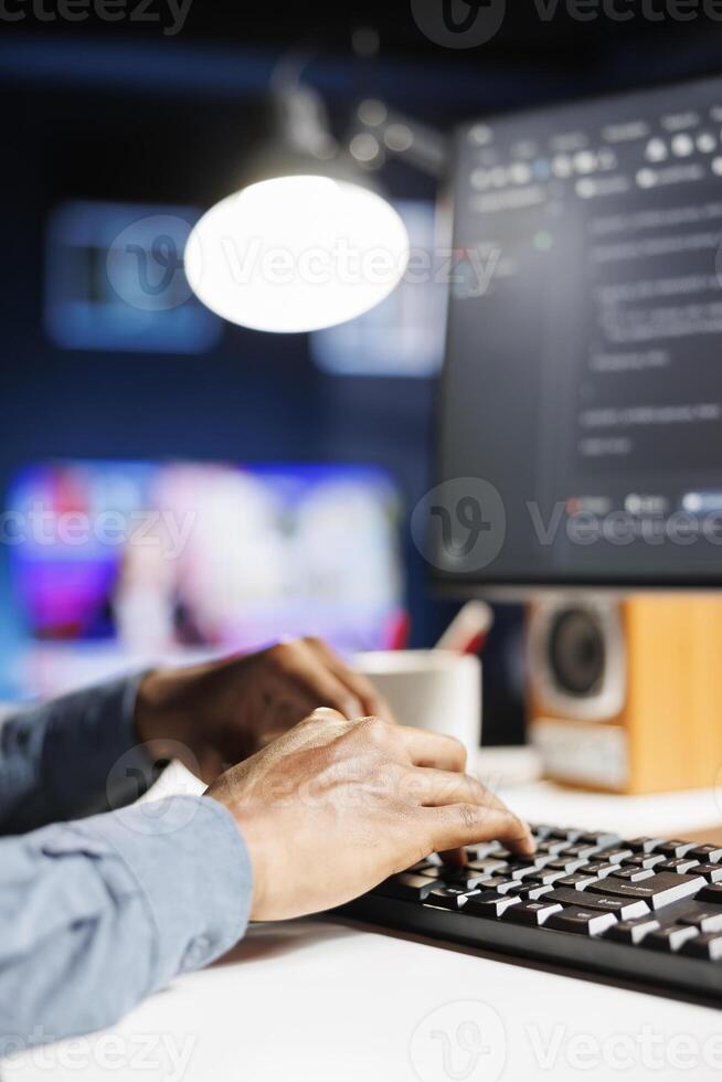 Software analyst applies programming skills to supply server security, using binary algorithms and html code on terminal window. Protection of databases is handled by IT engineer. Close up. photo