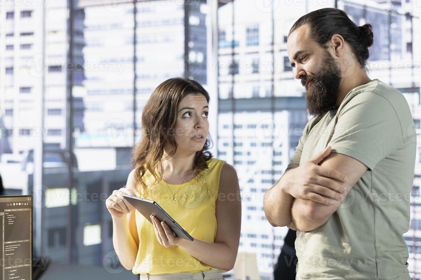 Team of data science workers conducting code review on tablet to fix bugs, identifying technical issues with artificial intelligence company software. IT staff members optimizing code using device photo