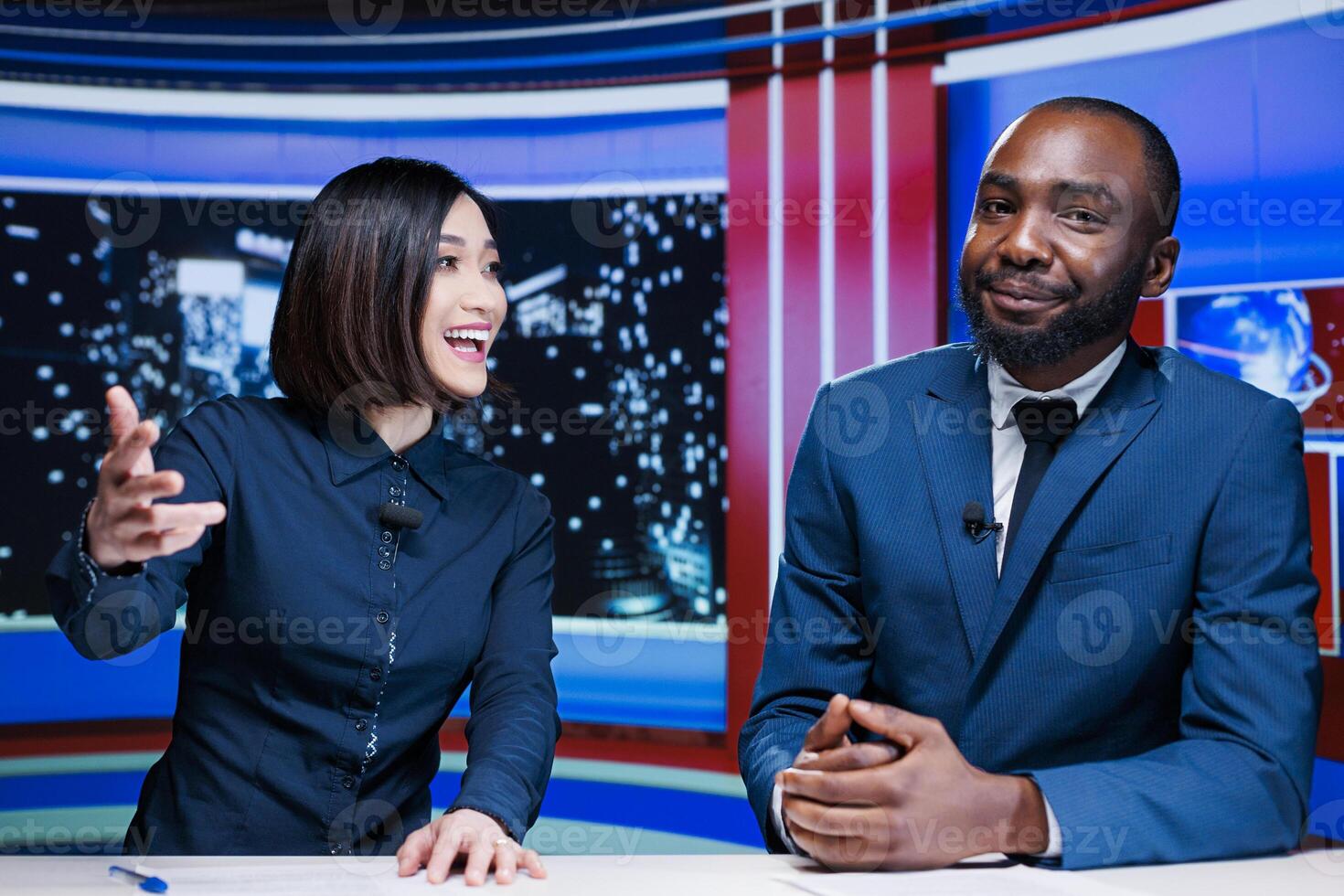 TV show hosts presenting breaking news live on television network, working together to create exclusive content for tv channel worldwide. Diverse journalists debate latest events. photo