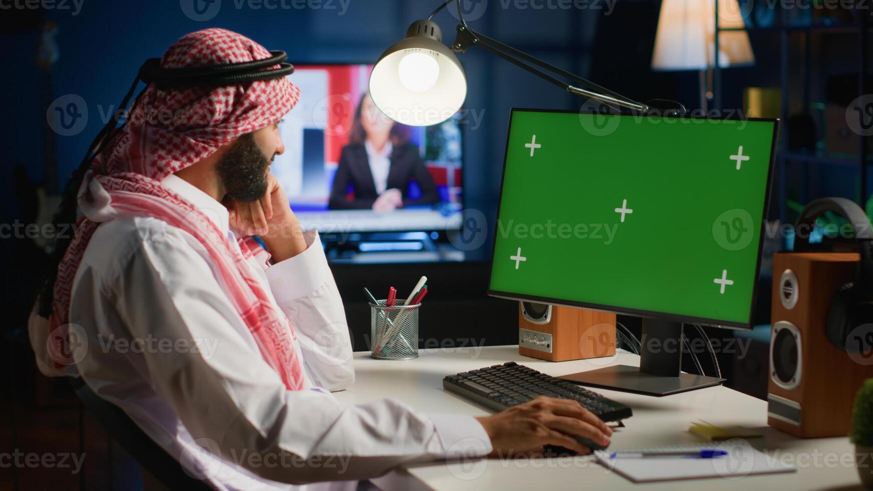 Relaxed remote worker inputting data on chroma key computer while working from home. Teleworking freelancer performing tasks on mockup device in apartment personal office photo