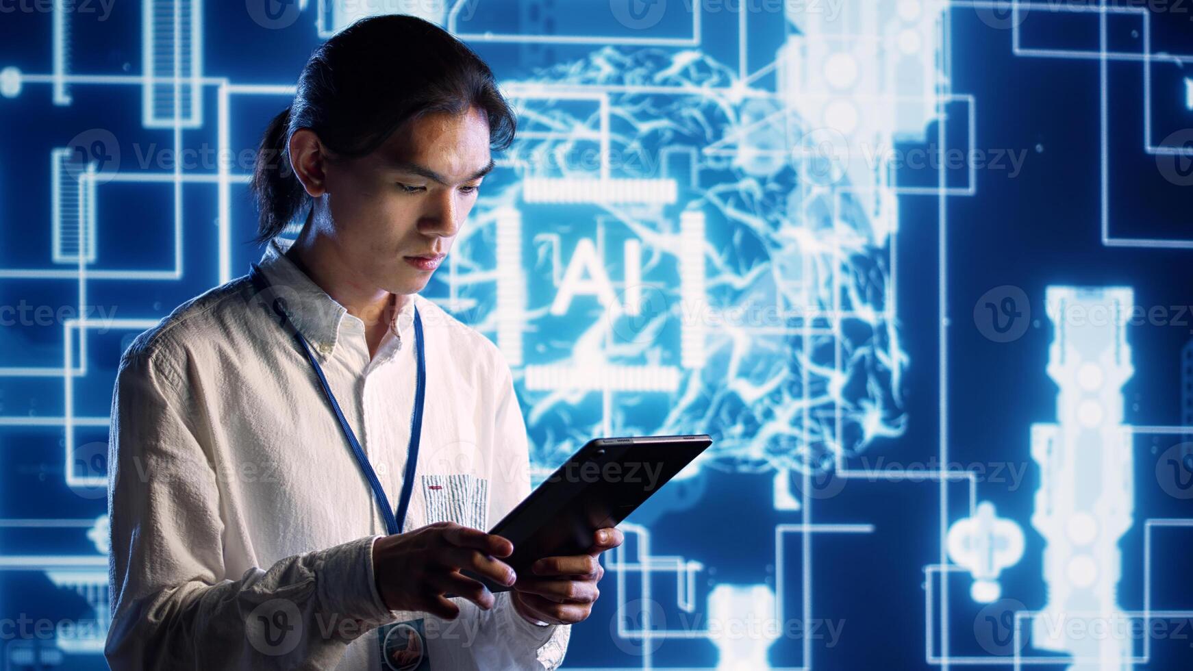 Asian developer using tablet to implement artificial intelligence parallel processing, breaking up complex computational tasks into smaller bits, enabling AI systems to process more input data faster photo