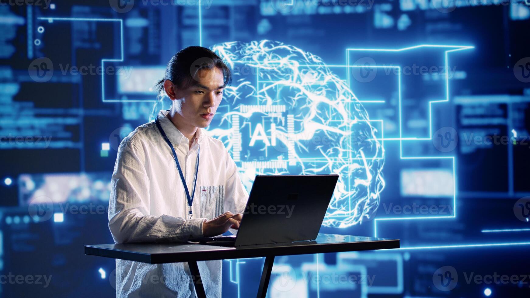 Engineer in technologically advanced workplace uses artificial intelligence computing simulating human brain. Admin in server hub running operations on laptop with AI machine learning algorithms photo