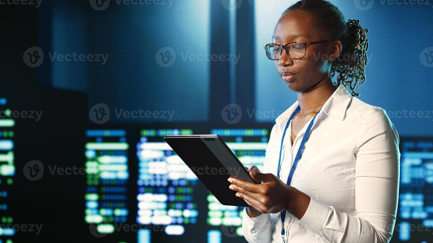 Adept professional strolling through server rows providing processing resources for different workloads. Knowledgeable manager monitoring supercomputers tasked with solving complex operations photo