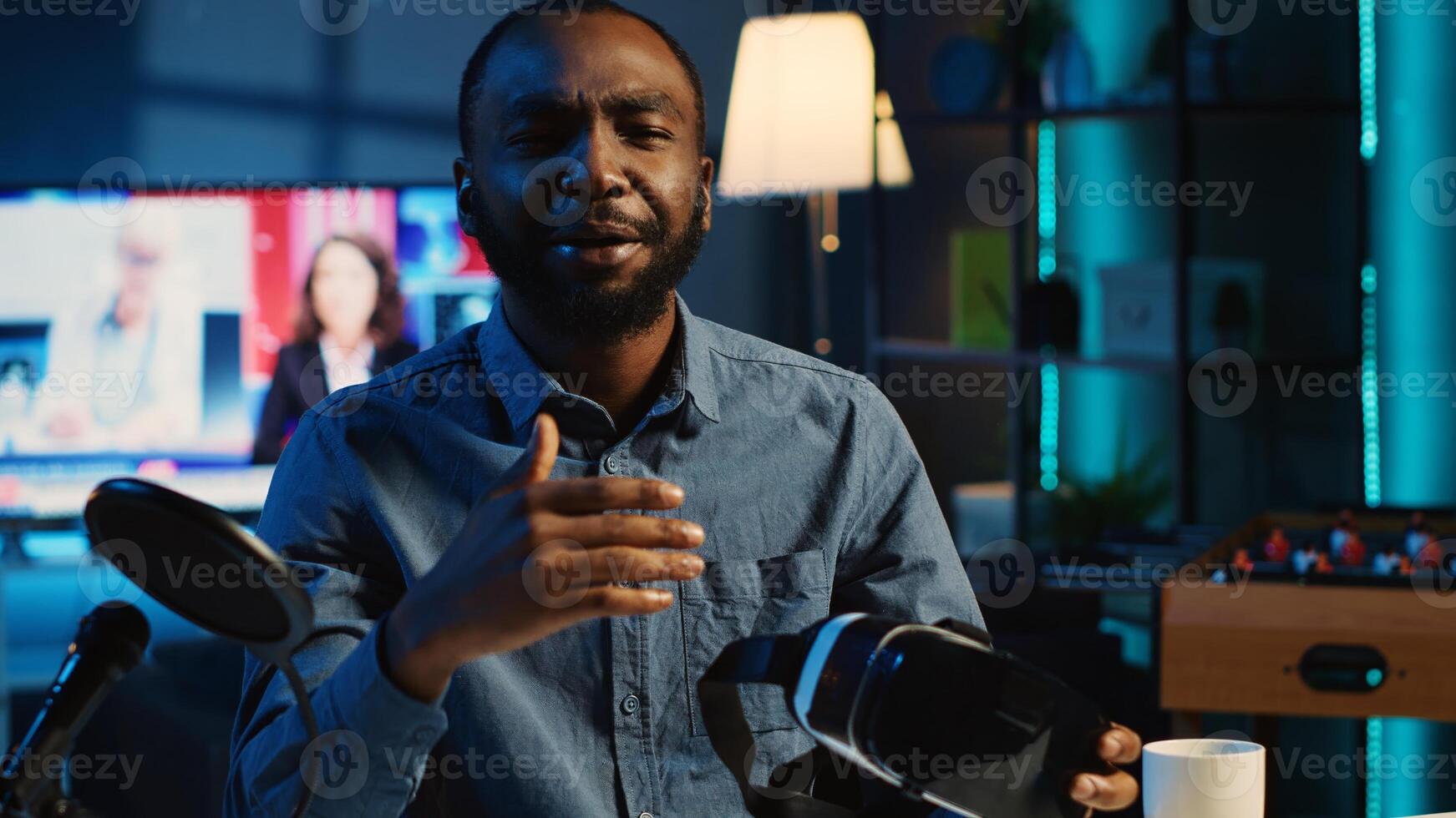 Content creator filming review of VR headset, unpacking it and presenting specifications to audience on online platform. Viral internet star showing virtual reality goggles to subscribers photo