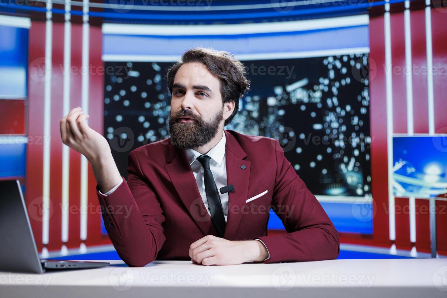 Correspondent for the media delivers latest stories while live events appear on worldwide tv headquarters. Expert reporter engages in news coverage in studio, presenting important information. photo