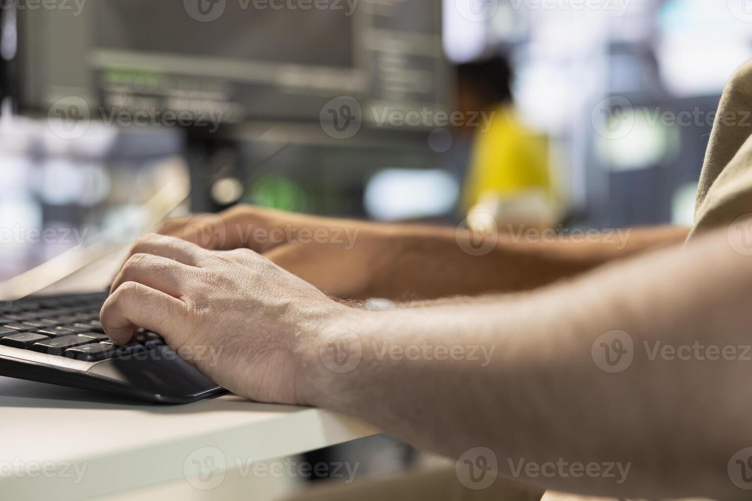Programmer types on keyboard, testing company software to minimize occurrence of bugs, identifying bottlenecks. Close up of man writing clean, efficient code in programming language to reduce glitches photo
