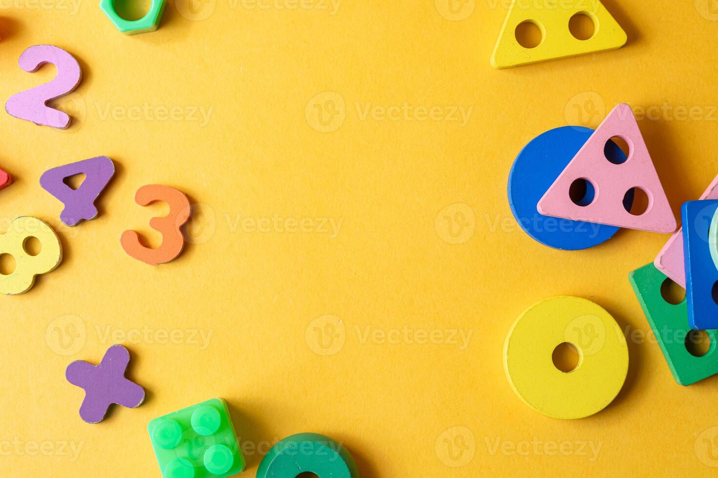 Colorful Educational Toys on Yellow Background photo