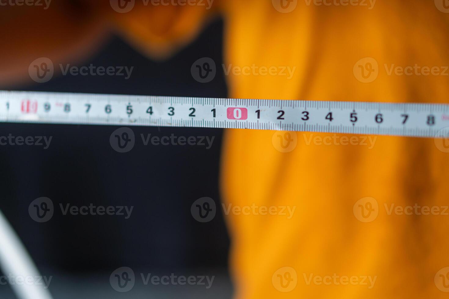 Close-up of Measuring Tape in Hand photo