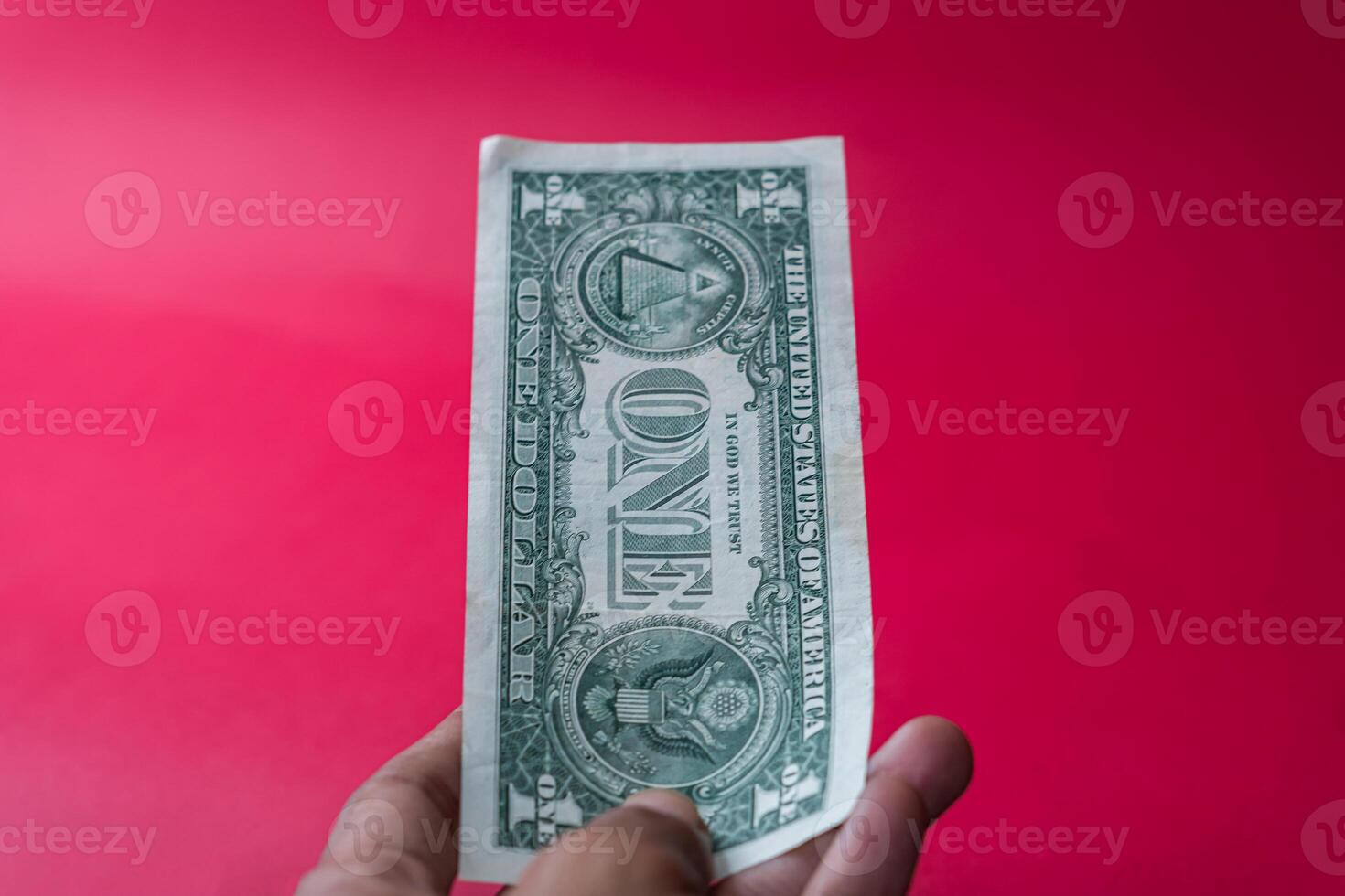 One Dollar Bill in Leather Wallet on Red Background photo