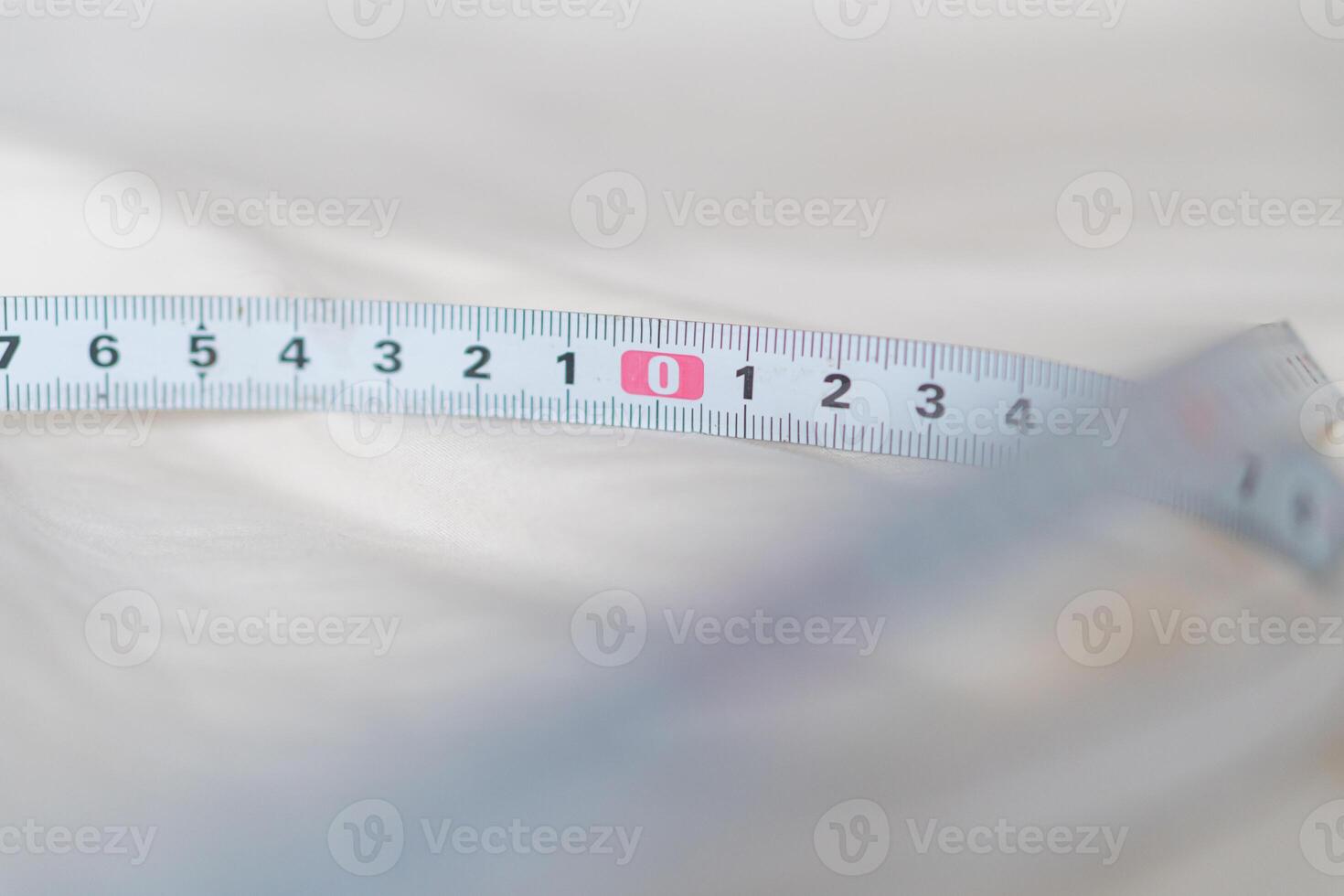 Close-up of Measuring Tape on Soft Surface photo