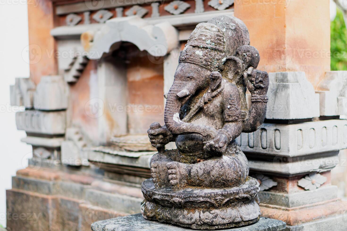 Stone Ganesha Statue in Balinese Architecture photo
