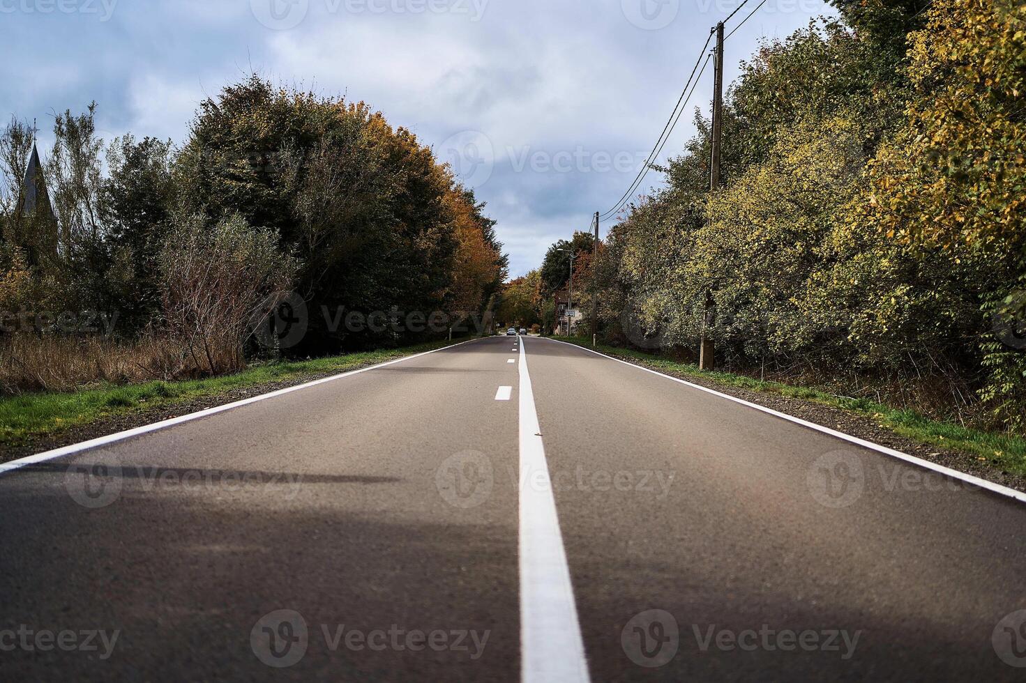 landscapes of an autumnal European village, Belgium, leaves colored by fall photo