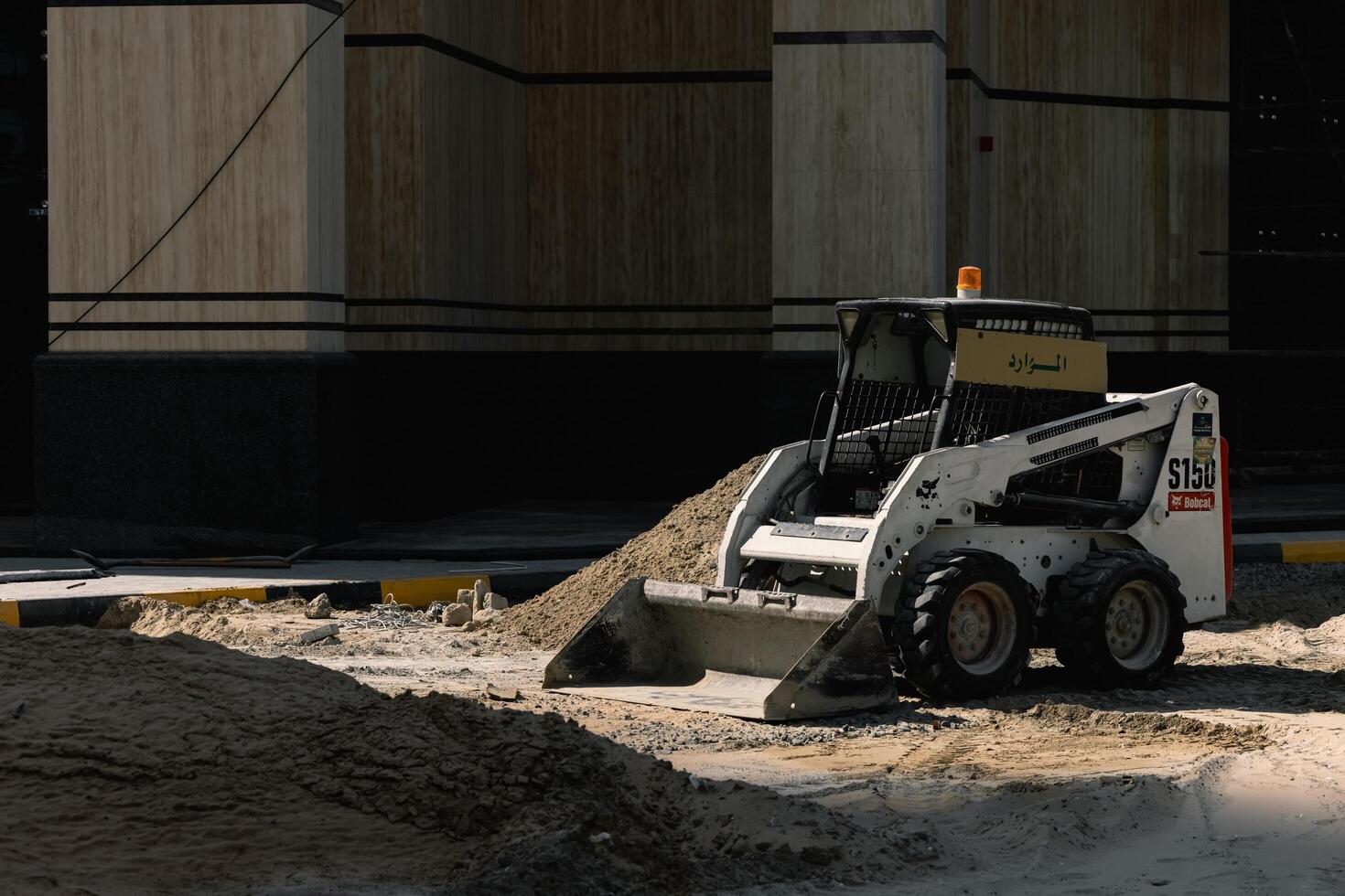 Dubai, UAE, December 28, 2022. A tractor on a construction site in Dubai. photo