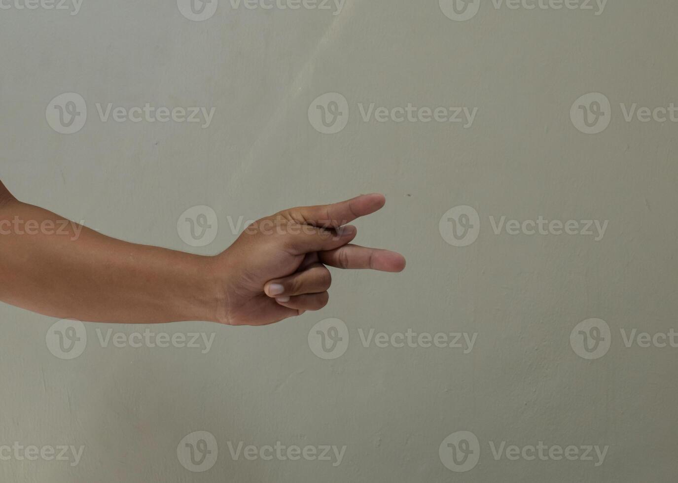 Finger spelling letter P in american sign language photo