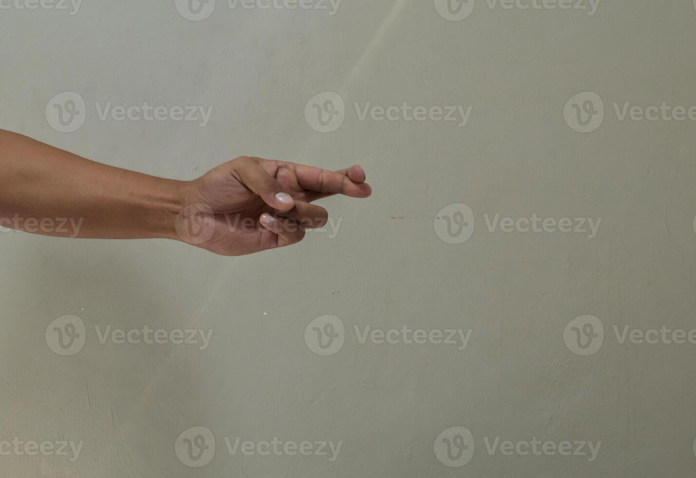 Finger spelling letter R in american sign language photo