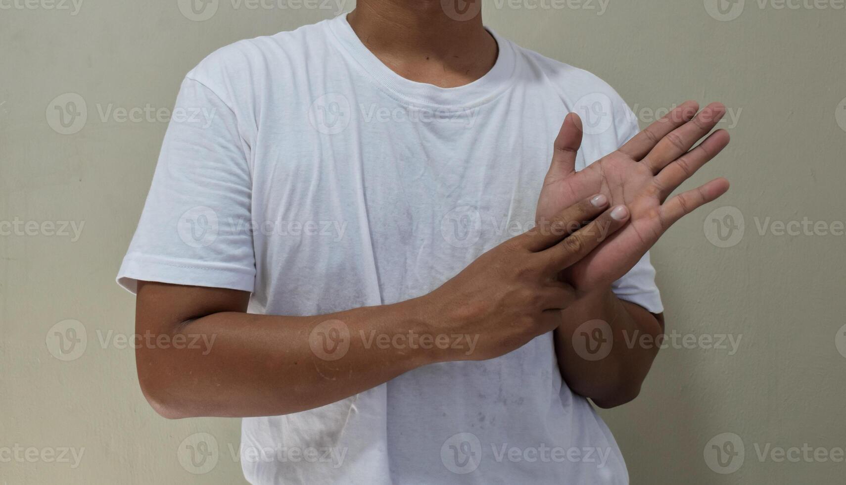 Lovely man showing a sign language, communication for deaf photo